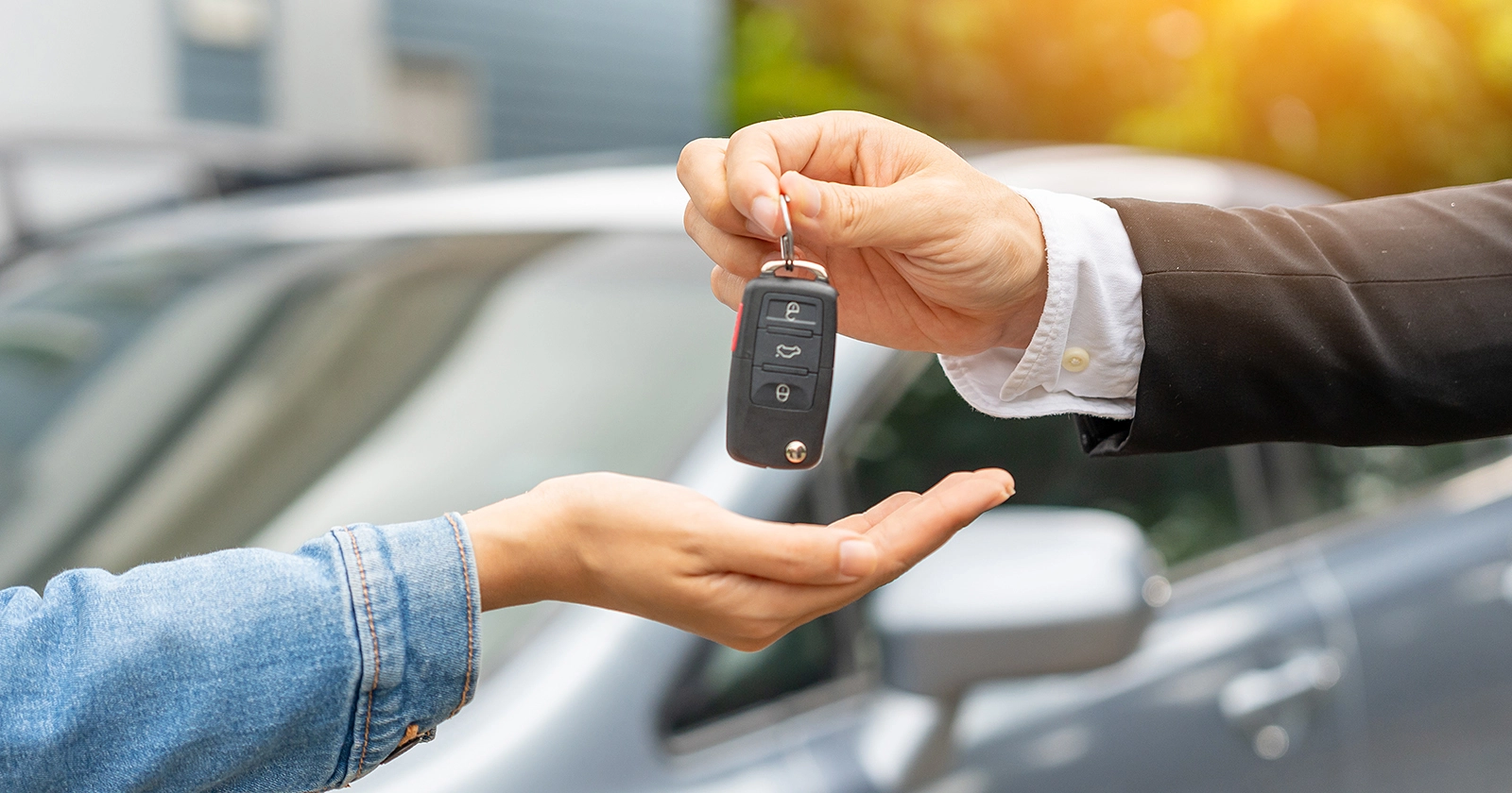 Photo of car keys being exchanged