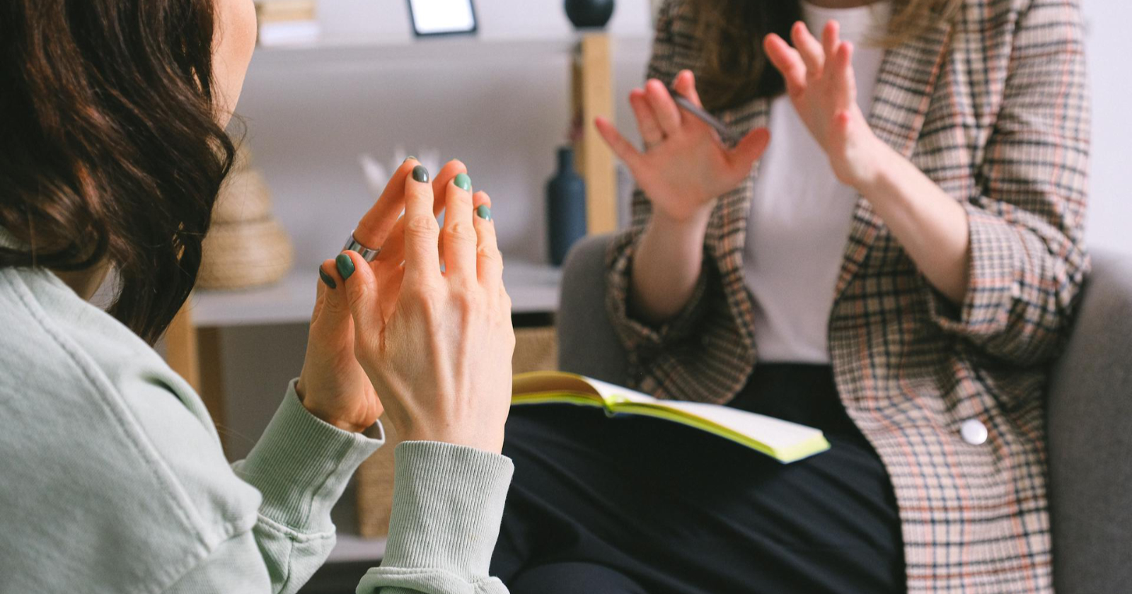 Photo of two people talking in an office