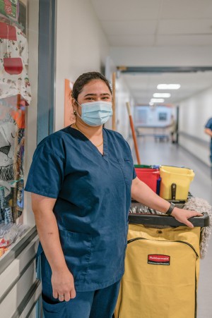 Housekeeping A staff member with cleaning supplies
