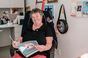 Aboriginal Nurse Liaison Portrait of a woman reading a book about aboriginal healing