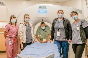 Medical Imaging Department - with the donor-funded CT scanner Portrait of a team at the hospital with a scanning device